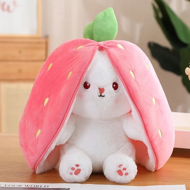 18cm Cosplay Strawberry Carrot Rabbit Plush Toy, a white bunny stuffed animal made of soft plush and PP cotton, encased in a strawberry-shaped cover with green leaf accents. Perfect for kids, collectors, or as a decorative nursery item, this plush toy transforms into a fruit-themed cuddly doll.