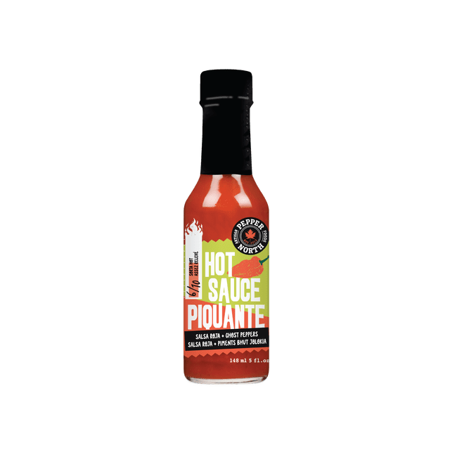 Pepper North Salsa Roja + Ghost Peppers Hot Sauce, 148ml bottle with black cap and green-orange label showing 6/10 heat level, made in Canada with local ingredients. This all-natural, gluten-free, vegan hot sauce is suitable for enhancing pantry condiments and recipes.