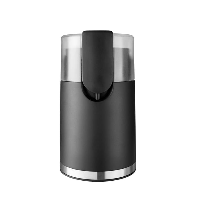 Mainstays Electric Coffee Grinder with 12 Cups capacity, matte black ABS housing with stainless steel base trim, transparent lid, and front safety lock lever, offering five grind settings and easy-to-clean stainless steel blades suitable for coffee beans, herbs, and spices.