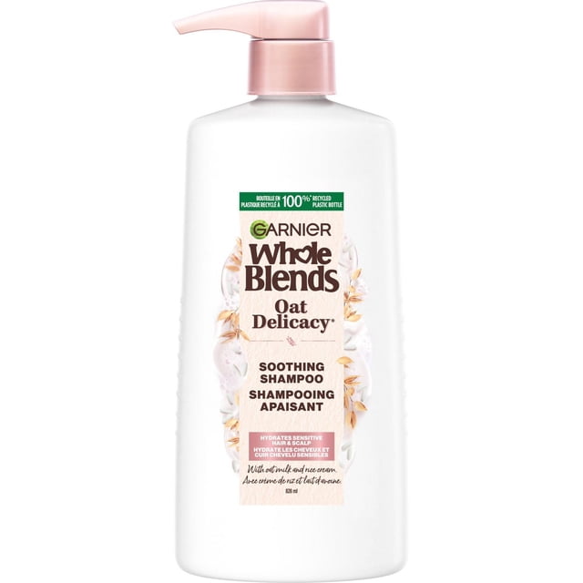 Garnier Whole Blends Shampoing Apaisant Délicat à l'Avoine en Bouteille Blanche de 828 ml avec une Pompe Rose Pâle, Formulé avec des Extraits de Lait d'Avoine et de Crème de Riz pour Hydrater, Adoucir et Hydrater en Douceur le Cuir Chevelu Sensible et les Cheveux Délicats, Sans Parabènes et Adapté à un Usage Quotidien.