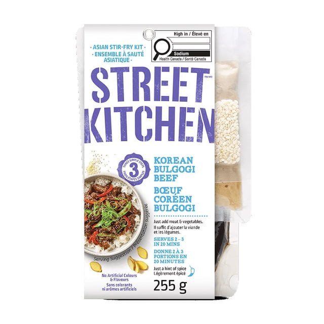 Street Kitchen Korean Bulgogi Beef Kit 255g with white packaging showing purple and blue text, a serving suggestion image of bulgogi beef with rice and vegetables, and visible seasoning packets including sesame seeds, designed for quick Asian stir-fry meals serving 2-3 in 20 minutes.