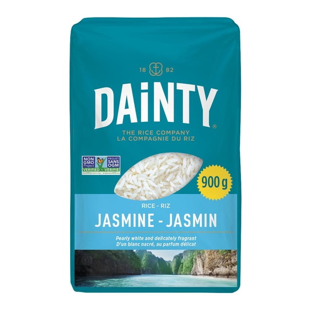 Dainty Jasmine Rice 900g package in teal and blue with a clear window showing pearly white long grains, labeled gluten free and non-GMO verified, featuring a scenic river and cliff landscape, suitable for fragrant white rice dishes.