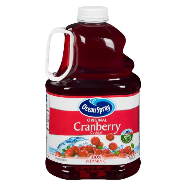 Ocean Spray Cranberry Cocktail 3 L clear plastic jug with white handle and cap, filled with deep red juice, labeled with cranberries and water splash, providing 100% vitamin C and supporting urinary tract health, often used for mixing with sparkling water or spirits.
