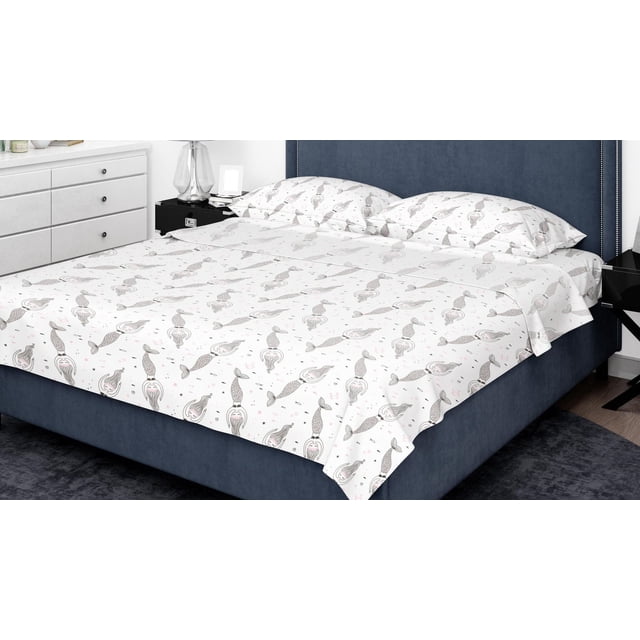 Johnson Home 200 TC Bed Sheet Set - Printed Cotton Sheets with white fabric featuring gray mermaid patterns and pink accents, crafted from breathable cotton for softness and comfort, displayed on a navy blue upholstered bed with matching pillowcases in a modern bedroom with white dresser and black nightstand.