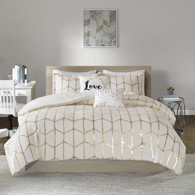 Home Essence Apartment Arielle Duvet Cover Set on a bed with a light wood headboard in a neutral bedroom. The white microfiber duvet cover and shams feature a metallic gold geometric print. Two decorative pillows include one square with gold dots and one oblong embroidered with 'Love' in black typography. The duvet cover has button closures and internal corner ties to secure the insert. The room includes a white desk with books and chair on the left, a round metal side table with a plant and books on the right, and a framed geometric artwork above the bed.