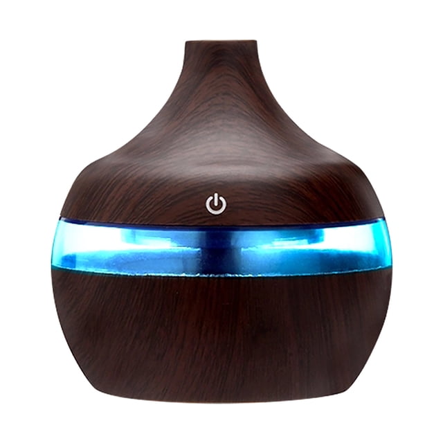 Essential Oils for Diffusers Aromatherapy New Portable Air Aroma Essential Oil Diffuser with LED light, featuring a compact design with a dark wood grain finish and a glowing blue light band. This 300ml aromatherapy diffuser offers 7-color night light options, USB connectivity, and is ideal for skin care, air humidification, and stress relief. Suitable as a portable humidifier for home or office use.