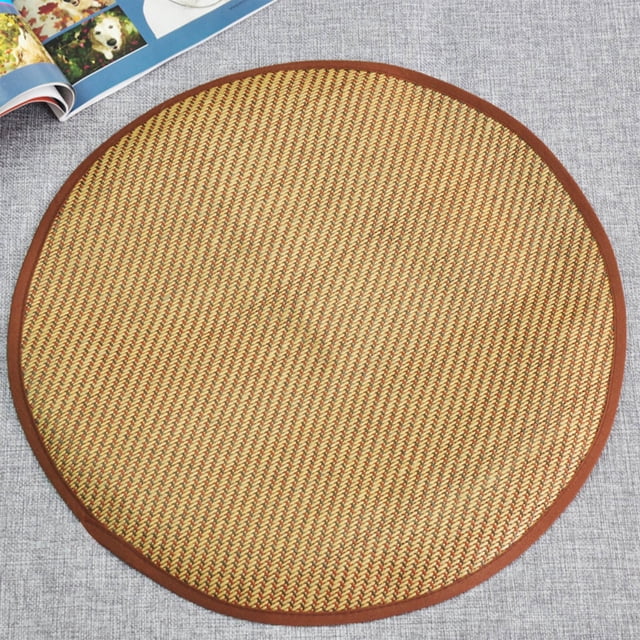 RXIRUCGD Cat Scratcher Mat, 11.8"x11.8" cat scratch mat made of woven rattan and linen with a fine weave pattern. The round mat features a brown border and a classic vintage style, designed to protect furniture like couches and carpets. Suitable for cats to scratch or rest on, it is lightweight, durable, and easy to clean. Shown on a grey textured surface with a magazine in the background.
