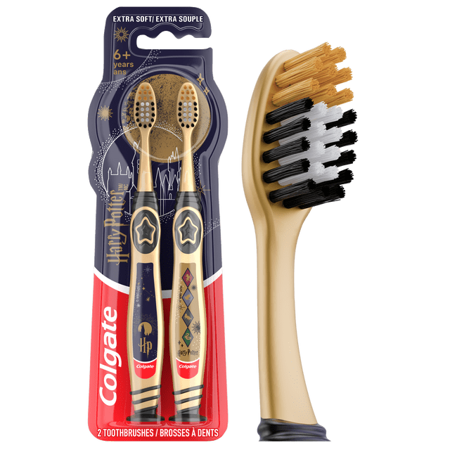 Colgate Harry Potter Manual Kids Toothbrush Pack, Extra Soft, 2 Pack with two gold and black toothbrushes featuring Harry Potter designs, extra soft multi-height bristles in white, gold, and black, wide thumb rest, rounded handle, and suction cup base for upright storage.