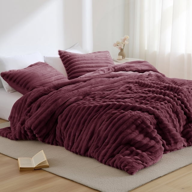 Regency Heights Full/Queen Size Comforter Set, a 3-piece bedding set in red, featuring a fluffy ribbed plush texture with a soft mink reverse. The set includes one comforter (90 inches by 90 inches) and two shams (20 inches by 26 inches) with overlapping enclosures for secure pillow placement. Made with premium 300 gsm fabric for added weight, softness, and warmth, this Oeko-Tex certified set ensures safety and gentle skin contact. Displayed on a bed in a bright room with natural light and minimal decor.