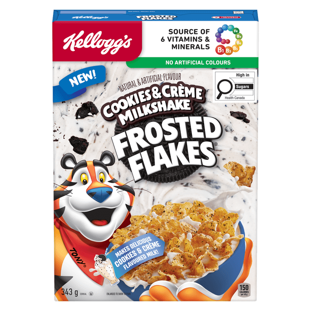 Kellogg's Frosted Flakes® Cookies & Crème Milkshake Flavour Cereal box displaying frosted corn flakes in a blue bowl with milk and cookie pieces. The packaging highlights it as a source of 6 vitamins and minerals, contains no artificial colours, and makes milk taste like cookies & crème milkshake. Tony the Tiger mascot is featured on the front. The 343 g box includes a Health Canada label indicating high sugar content. This cereal is suitable as a sweet breakfast or snack option.