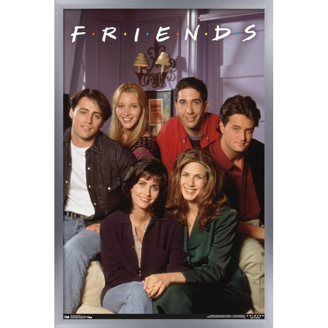 Friends - Apartment Wall Poster, 22.375" x 34" featuring the main cast of the TV show Friends seated in a living room with a purple wall and vintage sconces, framed in silver. Suitable for bedroom, office, or dorm wall décor, adding a nostalgic touch to any space.