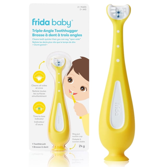 Frida Baby SmileFrida Training Toothbrush for Toddlers Triple-Angle Toothhugger manual toothbrush in yellow with white grip dots, featuring triple-angle bristles that clean all sides simultaneously, a soft silicone handle, and a stay-put suction cup base, shown in bilingual packaging with toddler brushing illustration, supporting oral hygiene habits.