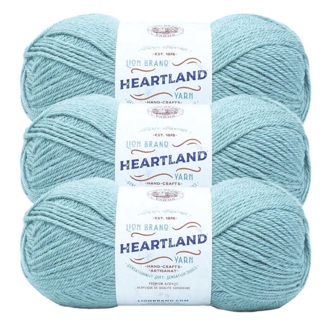 Lion Brand Yarn Heartland Yarn 3Pack in light blue, three skeins of worsted weight acrylic yarn with white labels showing brand and product details, machine washable and durable, suitable for knitting, crochet, and crafting projects.