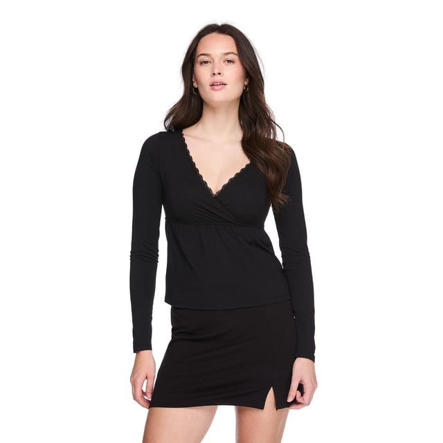 No Boundaries Women'S Long-Sleeve Babydoll Top centered front view of a junior-fit jersey knit top with lightweight drape; V-neck with scalloped lace trim, crossover front, long sleeves, gathered empire waist and flowy babydoll silhouette, 95% cotton/5% spandex. Suitable for layering under jackets or cardigans.