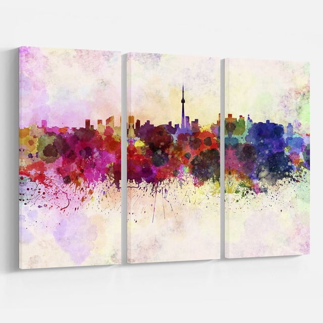 Design Art Toronto Skyline Canvas Print with three gallery wrapped cotton canvas panels depicting a watercolor abstract of Toronto’s skyline featuring the CN Tower silhouette in vibrant reds, purples, blues, and greens on a light background, ready to hang with included hardware, suitable for enhancing home or office décor.