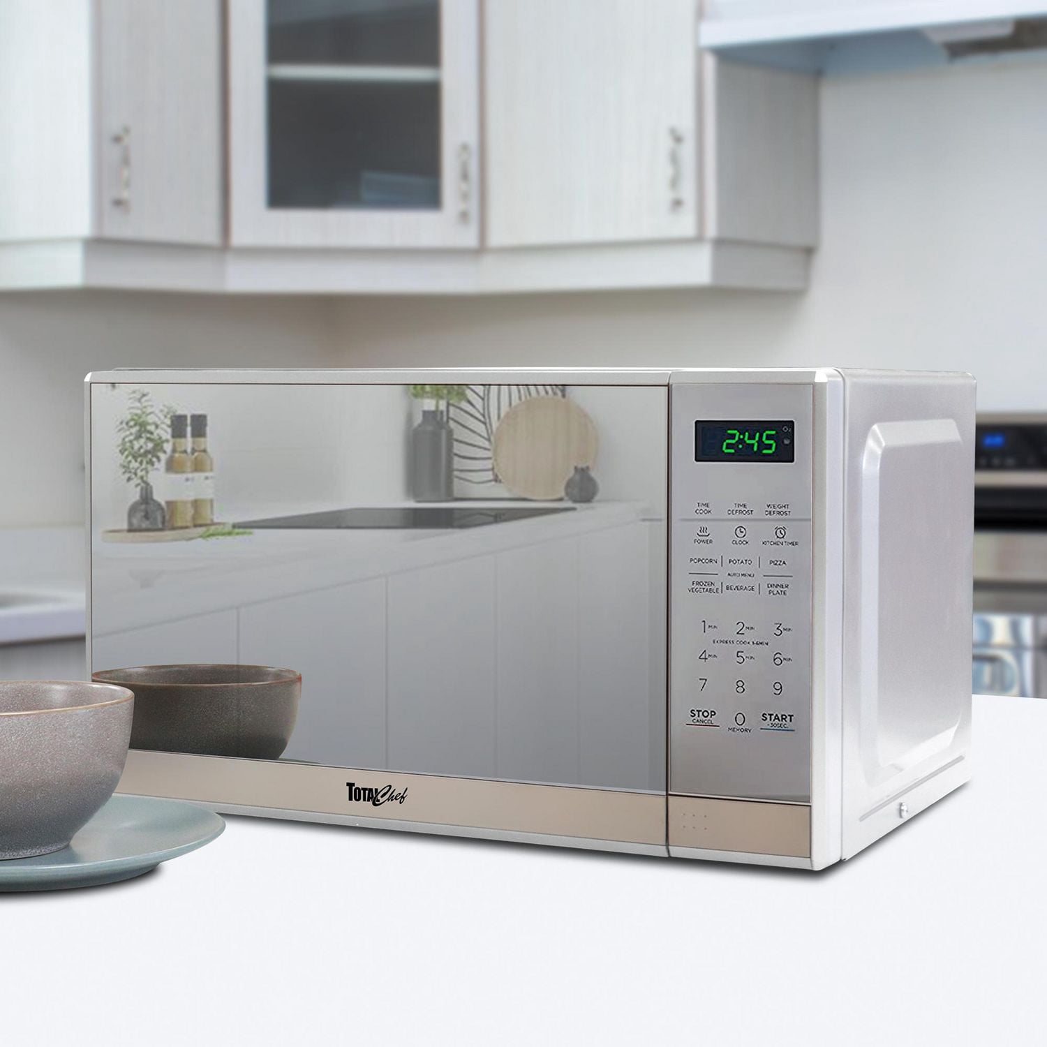 Micro-ondes de comptoir Total Chef en acier inoxydable, 0,7 pi³ (environ 20 L), avec affichage numérique à DEL, 700 watts
