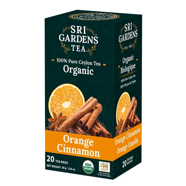 Sri Gardens Tea Orange Cinnamon, 20 Tea Bags. A box of certified organic Ceylon black tea blended with orange and cinnamon granules. Vibrant packaging highlights orange slices and cinnamon sticks, showcasing citrus and warm spice flavors. Ideal for organic pantry tea enthusiasts, with 20 individually wrapped tea bags for lasting freshness.