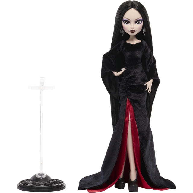 Poupée de Collection Monster High x Wednesday, Morticia Addams en Robe de Velours Noire, Figurine de Collection Orientée vers l'Avant en Robe de Velours Noire avec Manches Cloche et Détails Froncés. une Fente Révèle une Jupon en satin Cramoisi. Cheveux Noirs Épurés, Maquillage Accentué de Violet et Manucure Noire. Boucles d'Oreilles Argentées avec Pierre Noire et Bagues Assorties. Escarpins Noirs Montrent une venus flytrap sur un Talon et un Charme Cœur en Verre sur l'Autre. Support de Poupée Inclus; Ne