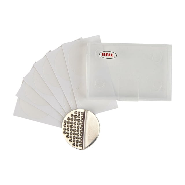Bell Sports STOPPER™ 300 Bicycle Tube Repair Kit with 12 glueless round patches fanned out beside a circular metal scuffer and a translucent plastic carrying case with Bell logo, designed for quick and convenient bicycle tire repairs.