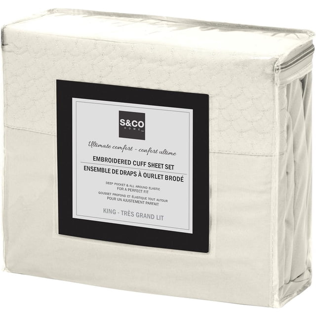 Safdie & Co. Sheet Set 4PC K Solid Ivory in a zippered fabric case with embroidered cuff design, deep pockets, and elastic edges for king-size beds, hypoallergenic and wrinkle-resistant, suitable for everyday use.