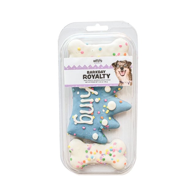 Mylo's Barkday Royalty Dog Treats in a clear plastic package with three decorated dog cookies: two white bone-shaped cookies with colorful confetti sprinkles and one blue crown-shaped cookie with white icing dots and the word 'King' written in white icing, featuring a label with a happy dog's face.