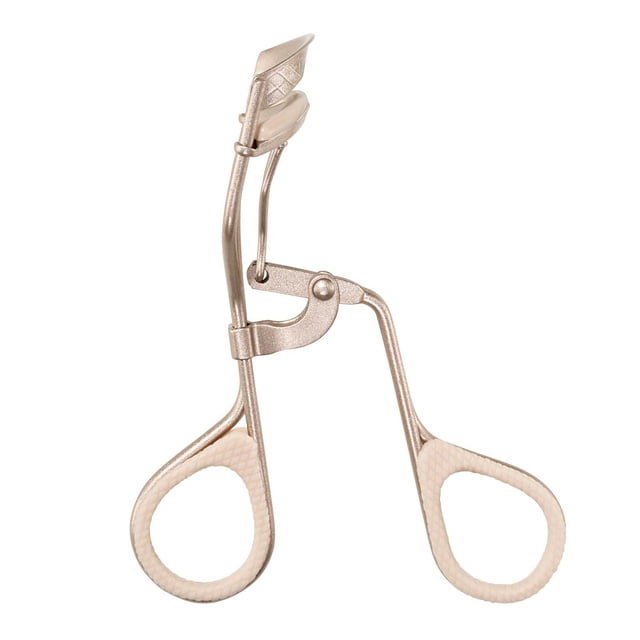 Revlon® The Designer Collection Lash Curler in neutral glam finish with textured finger grips and a curved curling pad designed to lift lashes at the center of the eye for a larger, eye-opening look, ideal for daily beauty routines.