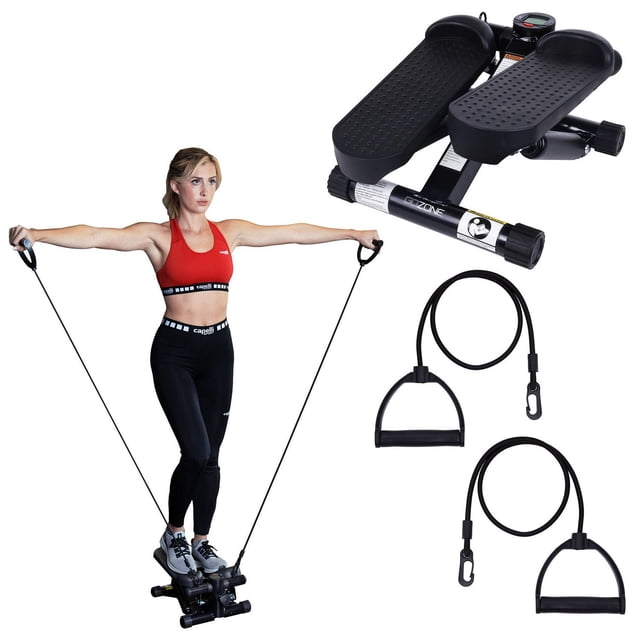 GoZone Mini Stepper – Black with textured foot pedals and two foam handle resistance bands, shown both detached and in use by a person exercising, designed for compact cardio and muscle-toning workouts in small spaces like home or office.