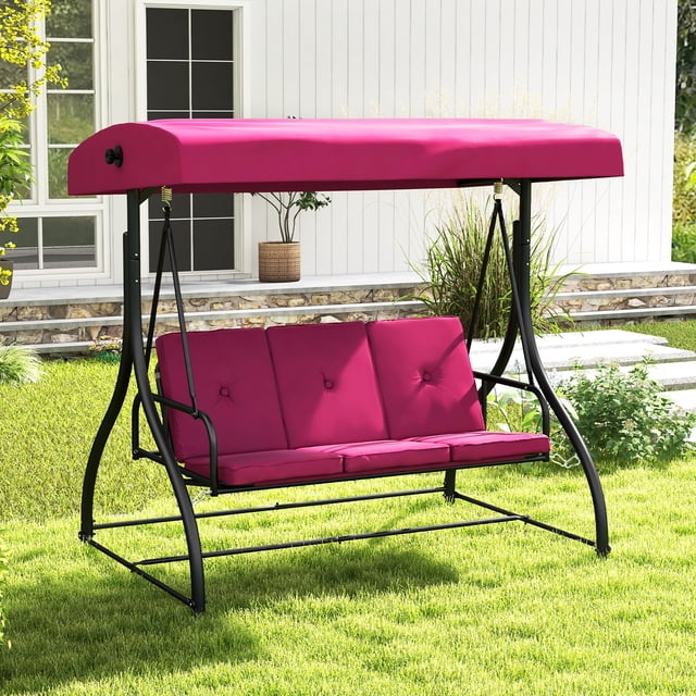 Gymax Chaise de Patio Convertible Swing Porch Swing Lit avec Auvent Ajustable et Coussin Épaissi Couleur Vin. Cet Auvent Swing Présente un Cadre en Métal Noir durable, des Accoudoirs Courbés et des Assises Spacieuses pour jusqu'à Trois Personnes. Idéal pour les Installations de Meubles d'Extérieur, Il Est Montré dans une Cour Gazonée avec une Maison Blanche en Arrière-Plan.