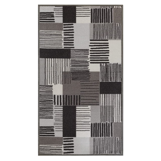 BY COCOON 2'x5' runner rug in grey with a modern geometric pattern featuring various rectangular and linear designs. Made from durable, stain-resistant polypropylene with a non-slip rubber backing. Ideal for high-traffic areas like hallways, kitchens, and entryways. Low pile thickness of 0.2 inches ensures it fits under doors and furniture. Washable and easy to maintain, suitable for homes with kids and pets.