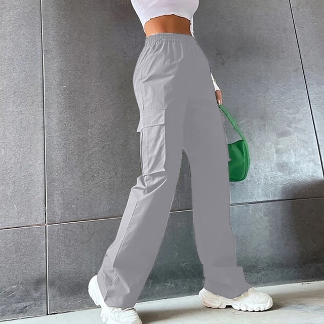 Zanvin Women's High Waist Straight Cylinder Cargo Pants in solid grey color, featuring a high-waist fit and straight-leg design with side cargo pockets. Made from durable polyester material, these casual pants are suitable for daily wear, yoga, or outdoor activities. Styled with white sneakers and a green handbag, the pants are shown in a modern, urban setting.