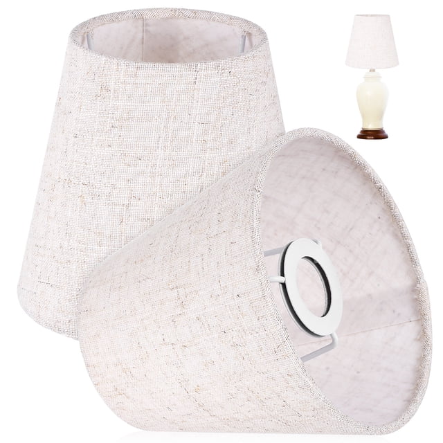 2pcs fabric lamp shades designed as lamp shade replacements and dust covers for floor lamps and table lights. Made of linen fabric and iron, these shades feature a natural texture in a neutral tone. The image shows two conical lamp shades with a metal frame, suitable for various lamp types including chandeliers, table lamps, and floor lamps. Dimensions are 14.00x13.00x9.00cm (5.50x5.11x3.54in).