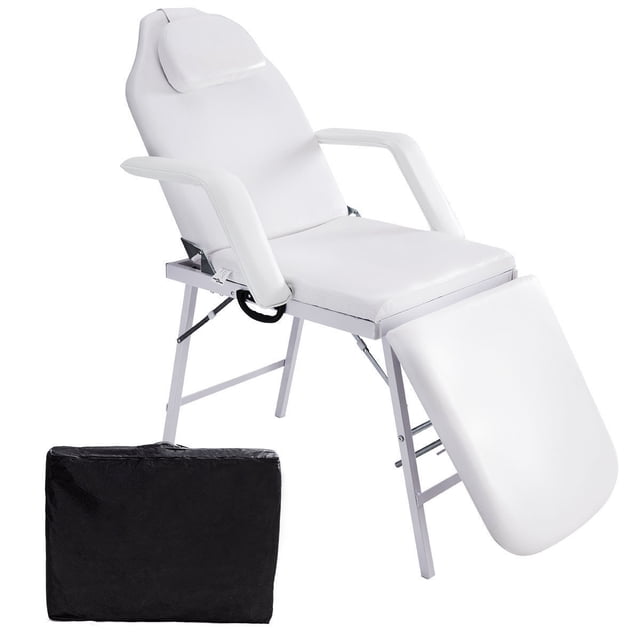 Costway 73" Portable Tattoo Parlor Spa Salon Facial Bed Beauty Massage Table Chair in white, designed for professional therapists and home users. Features adjustable backrest and footrest, removable armrests, and a face pillow with a 6-inch round hole. Includes a black non-woven carrying bag, ideal for spa treatments, massages, and tattoo sessions.
