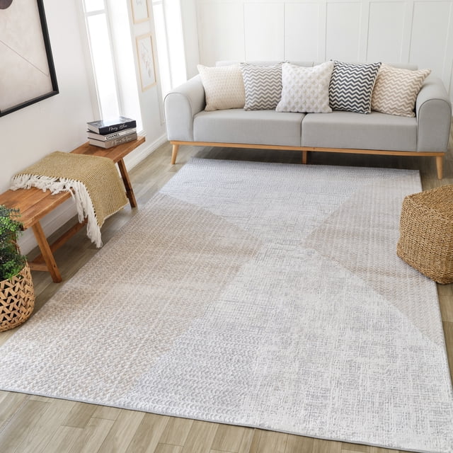 Rug Branch Cadence Abstract Indoor Area Rug in beige cream, 8'x11' (7'10" x 10'10"), 100% polyester with a modern geometric pattern, shown in a bright living room beneath a light grey sofa with decorative cushions, ideal for living room, bedroom, dining, or kitchen spaces.