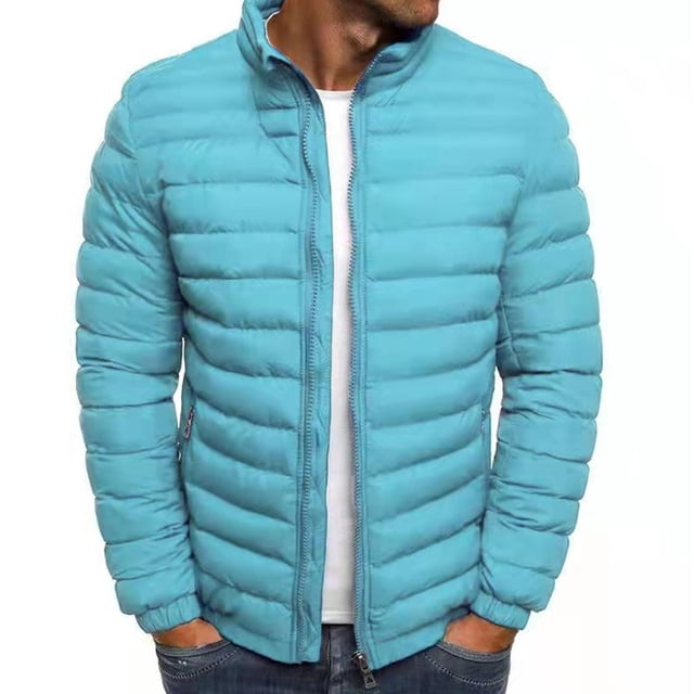 Mens Solid Color Jacket Cotton Padded Jacket Fashion Cotton Padded Jacket Mens Warm Cotton Padded Jacket. A front-facing view of a light blue polyester padded jacket with horizontal quilting, a high collar, and a full-length zipper. The jacket features long sleeves and side pockets, designed for warmth and versatility. Worn over a white shirt and paired with jeans.