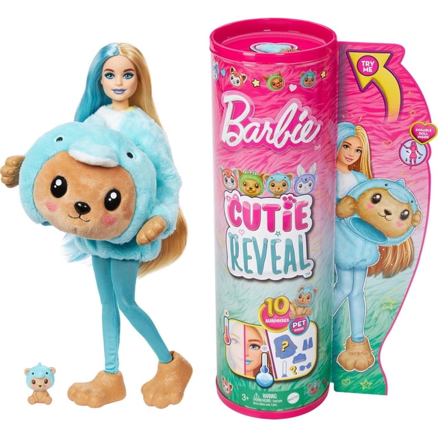 Barbie Cutie Reveal Poupée - Dauphin Vêtu d'Un costume de Dauphin Bleu en Peluche avec une Capuche Visage d'Ourson, des leggings Bleus et de Grands Pieds en Peluche Bruns, Debout à Côté de Son Emballage Cylindrique Rose Présentant des Graphiques Colorés et Mettant en Valeur 10 surprises Incluant un mini Animal de Compagnie et des Accessoires.