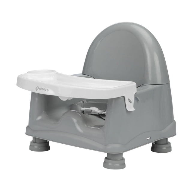 Safety 1st Easy Care Swing Tray Booster in grey with a white 1-hand swing-out tray and cup holder, 3-point harness, 3-level height adjustment, and adjustable chair straps for secure fit on adult chairs, designed for easy cleaning with a dishwasher-safe tray.