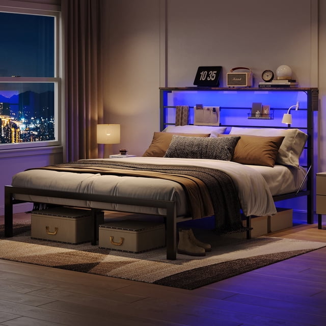 Bestier Queen Size Bed Frame with 49.2" High LED Storage Headboard Shelf, Metal Platform Bed, Black featured in a stylish bedroom. The ergonomic high headboard includes adjustable LED lighting and storage shelves for decor or essentials. The sturdy black metal frame ensures noise-free sleep and anti-slip support, with underbed storage for boxes and fabric side pockets. A cityscape view through the window adds to the relaxing ambiance.