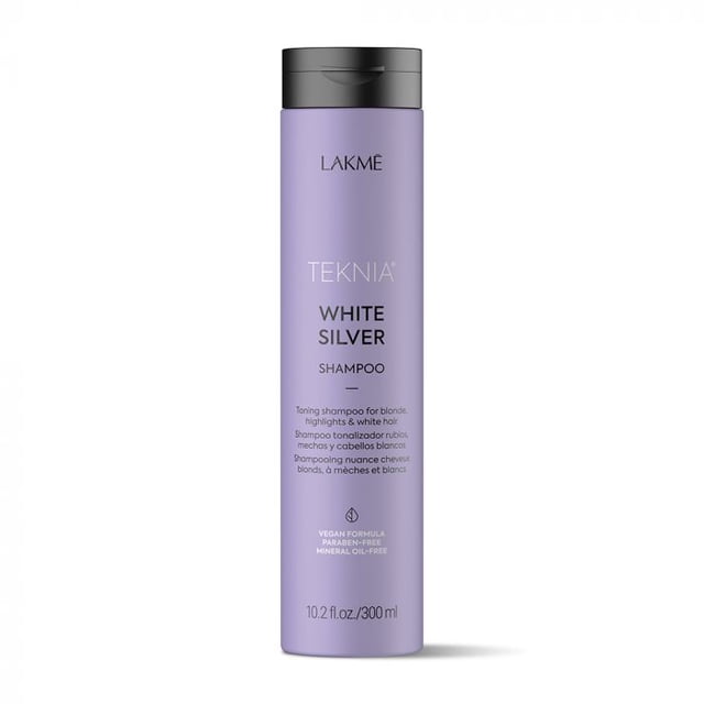 Lakmé TEKNIA White Silver Shampoo in a 300ml lavender-colored bottle with a black cap. Designed for toning blonde, highlighted, and white hair, it eliminates yellow tones, prevents warm highlights, and enhances shine. Vegan, paraben-free, and mineral oil-free formula.