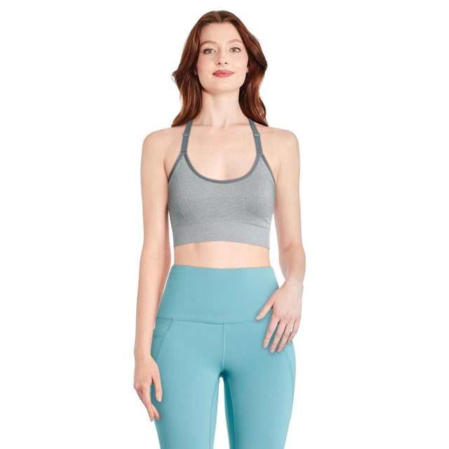 Athletic Works Women's Cami Yoga Bra in grey, made with seamless jacquard knit and DRI-MORE moisture-wicking technology, featuring a round neckline, adjustable straps, and Y-back design, shown with high-rise teal leggings, ideal for yoga and light exercise.