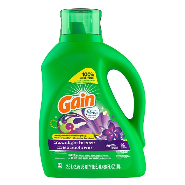 Gain Liquid Laundry Detergent Moonlight Breeze Scent in a green plastic jug with handle and measuring cap, featuring purple floral graphics and Febreze freshness label, designed for odor fighting and lasting freshness for 61 loads, 2.6 L (88 fl oz).