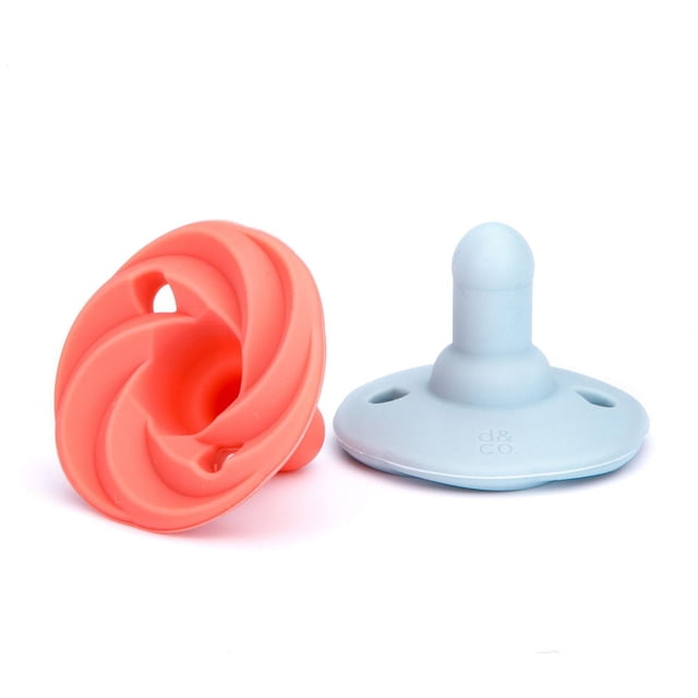 Doddle & Co - Baby, Infant - Holland Pop Silicone Pacifier - Stage 2 - Natural Shape - 2 Pack - Peach / Cloud 9 showing two silicone pacifiers on a white background, one peach with a spiral bubble design and one light blue with a natural-shaped nipple and ventilation holes, made for babies 3+ months and BPA-free.