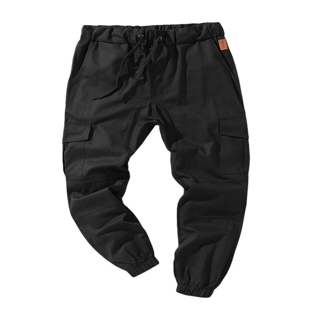 Men Solid Color Cargo Trousers Loose Fit Drawstring Waist Long Pants in black. These casual pants feature a drawstring waist, elasticized cuffs, and multiple pockets for utility. Made from a cotton blend, suitable for spring and autumn wear.