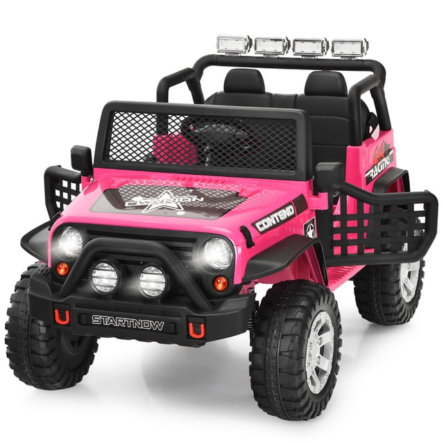 Gymax 12V Electric Kids Ride On Car Truck in pink, featuring a rugged design with large 12-inch wheels, bright LED lights, and a front grille. The car includes a spacious seat with a safety belt, functional doors, and a dashboard with MP3 and USB ports. It offers two driving modes: manual operation for kids and a 2.4G remote control for parents. Suitable for children aged 3 years and older, it has a weight capacity of 110 lbs and speeds ranging from 1 to 5 mph. Accessories include a charger, remote, and audio cable.