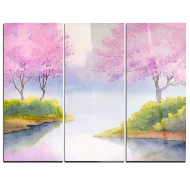 Design Art Flowering Trees over River Multipanel Landscape Metal Wall Art features a three-panel aluminium set with a high gloss finish, depicting pink flowering trees and green foliage by a river in watercolor style. Mounted on a wood subframe for a floating effect, it arrives ready to hang and suits modern home or office décor.