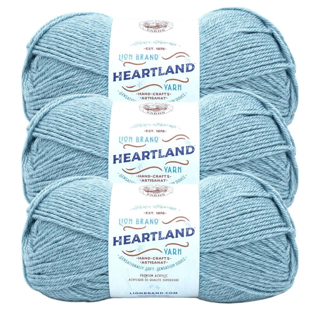Lion Brand Yarn Heartland Yarn 3Pack showing three skeins of light blue medium worsted weight acrylic yarn with white Heartland labels, perfect for durable, machine-washable knitting and crochet projects, often used for soft handmade crafts.