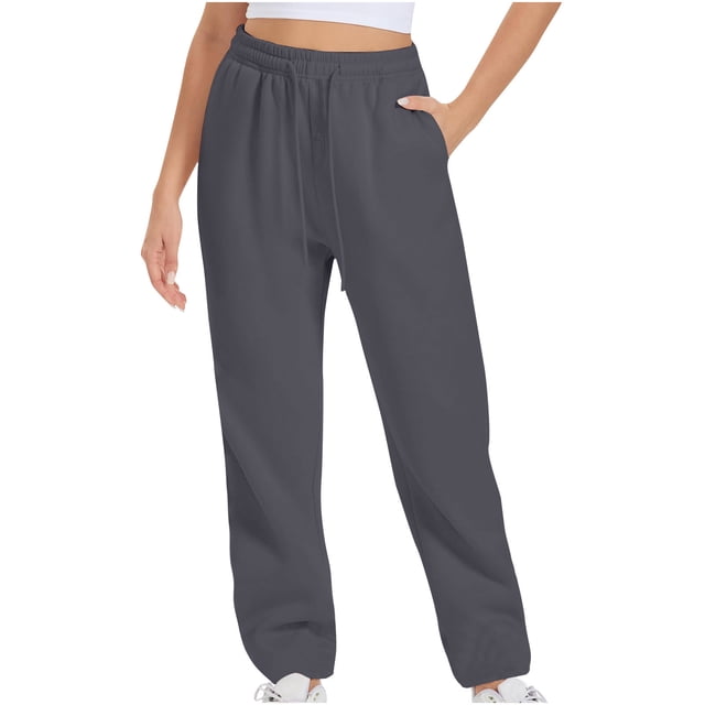 Timegard Women's Sweatpants Jogger Pants with elastic waist and solid color design, shown in a dark grey shade. These trousers feature a relaxed fit with side pockets, crafted from 95% polyester and 5% spandex for a soft, breathable, and lightweight feel. Ideal for workouts, lounging, or casual outings.