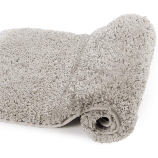 GHSDFBB Large Bathroom Rug (24x48, Light Tan) with a shaggy microfiber surface for extra softness and luxury. This machine washable bath mat features ultra-absorbent fibers and a non-slip TP rubber backing, ideal for bathroom floors to prevent water damage and provide comfort.