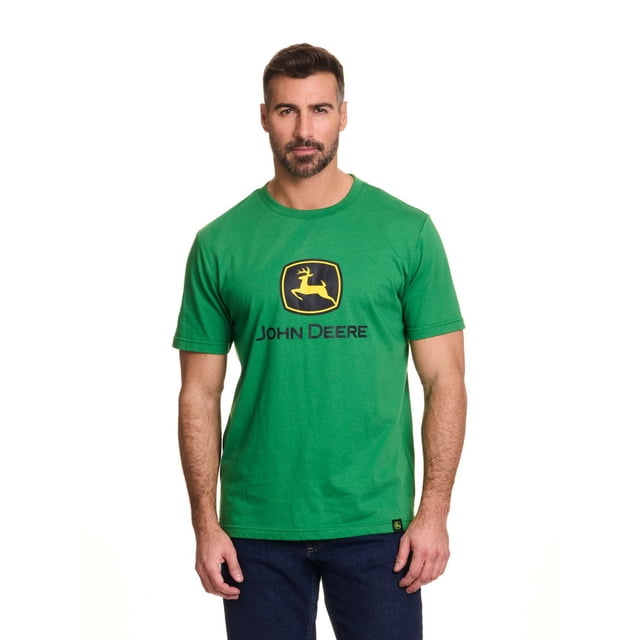 John Deere Men’s Logo Graphic Short Sleeve Tee in green jersey fabric with the yellow and black John Deere core logo screen printed on the chest, worn by a male model with dark blue jeans, ideal for casual wear or pairing with John Deere shorts or pants.
