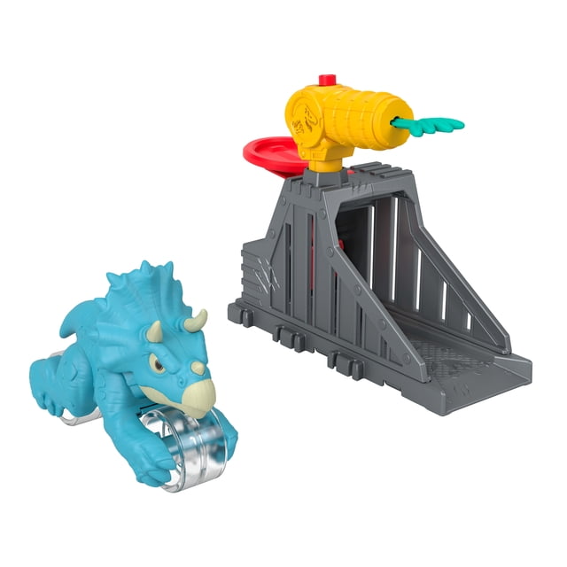 Imaginext Jurassic World Launcher Set with Chomping Toy Triceratops and 2 Accessories showing a blue 4.25-inch Triceratops dinosaur figure with chomping jaws and rolling wheels beside a gray launcher with a yellow dinosaur-themed blaster and red launching pad, suitable for interactive dinosaur racing play.