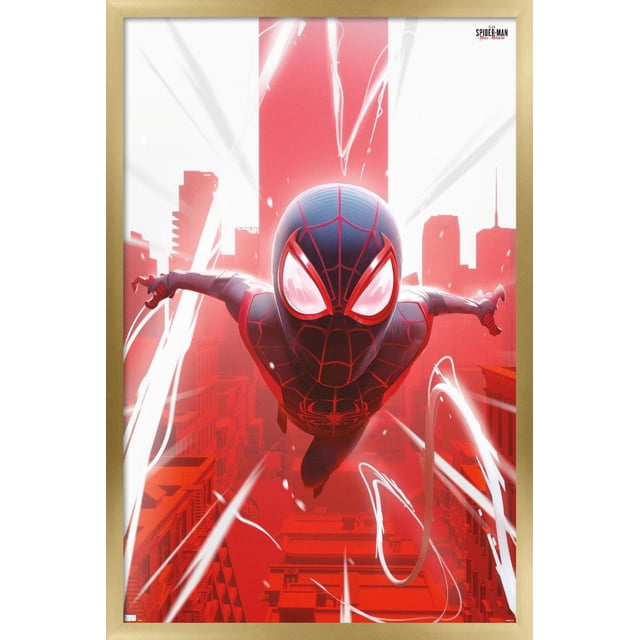 Marvel's Spider-Man: Miles Morales - Falling Wall Poster, 22.375" x 34" depicts a centered, front-facing view of Spider-Man in a black and red suit diving through a stylized red cityscape with white web trails, printed on glossy poster paper and framed in light wood, suitable for bedroom or office wall decor.
